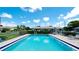 Community pool area with patio furniture at 2704 60Th Avenue S Plz # 2704, Bradenton, FL 34207