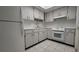 White kitchen with ample cabinet space and appliances at 6023 Hibiscus Dr # 177, Bradenton, FL 34207