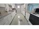 Updated kitchen with granite counters and white cabinets at 6023 Hibiscus Dr # 177, Bradenton, FL 34207