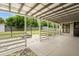 Covered back patio with stone floor and access to the backyard at 2015 Bayshore Gardens Pkwy, Bradenton, FL 34207