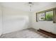 Spacious bedroom with wood-look flooring and window at 2708 60Th Avenue W Ter # A, Bradenton, FL 34207