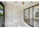 Covered and tiled sunroom with sliding glass doors at 2708 60Th Avenue W Ter # A, Bradenton, FL 34207