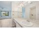 Bathroom with vanity, mirror, and view of bedroom at 2708 60Th Avenue W Ter # A, Bradenton, FL 34207