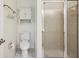 Clean bathroom with toilet, shower, and small cabinet at 2708 60Th Avenue W Ter # A, Bradenton, FL 34207