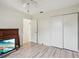 Bedroom with wood-look floors, a closet, and access to another room at 2708 60Th Avenue W Ter # A, Bradenton, FL 34207