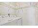 Well-lit laundry room, featuring washer, dryer, and ample shelving at 2708 60Th Avenue W Ter # A, Bradenton, FL 34207