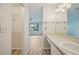 Bathroom with vanity, mirror, and view of bedroom at 2708 60Th Avenue W Ter # A, Bradenton, FL 34207