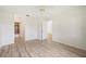 Spacious bedroom with ceiling fan and wood-look flooring at 2708 60Th Avenue W Ter # A, Bradenton, FL 34207