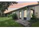 Rear exterior of condo showcasing sliding glass doors and patio at 2708 60Th Avenue W Ter # A, Bradenton, FL 34207