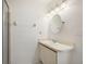 Bright bathroom with vanity and round mirror at 2708 60Th Avenue W Ter # A, Bradenton, FL 34207