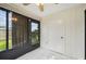 Bright sunroom with tiled floors, sliding glass doors and a storage closet at 2708 60Th Avenue W Ter # A, Bradenton, FL 34207