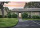 Exterior view of a condo unit with a landscaped yard and parking at 2708 60Th Avenue W Ter # A, Bradenton, FL 34207