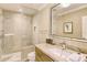 Modern bathroom with a walk-in shower and granite vanity at 915 Seaside Dr # 613 Weeks 28-29, Sarasota, FL 34242