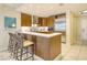 Modern kitchen with wood cabinets, stainless steel appliances, and island at 915 Seaside Dr # 613 Weeks 28-29, Sarasota, FL 34242