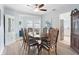 Elegant dining room with stylish table, chairs, and view into the kitchen at 5307 2Nd Avenue Nw Dr, Bradenton, FL 34209