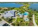 Aerial view of community pool, spa, and clubhouse at 7889 Mainsail Ln, Sarasota, FL 34240