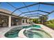 Relaxing pool and spa with covered patio and lounge chairs at 4803 Cabreo Ct, Bradenton, FL 34211