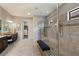 Spacious bathroom with double vanity, large shower, and walk-in closet at 4803 Cabreo Ct, Bradenton, FL 34211