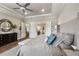 King-size bed in main bedroom with access to the ensuite bathroom at 4803 Cabreo Ct, Bradenton, FL 34211