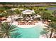 Relaxing poolside bar with lounge chairs and umbrellas at 4803 Cabreo Ct, Bradenton, FL 34211