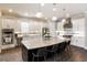 Modern kitchen with large island, stainless steel appliances & white cabinets at 4803 Cabreo Ct, Bradenton, FL 34211