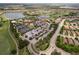 Aerial view of the community clubhouse, pool, and tennis courts at 4803 Cabreo Ct, Bradenton, FL 34211