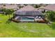 Private pool and screened patio with lounge chairs at 4803 Cabreo Ct, Bradenton, FL 34211