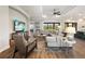 Spacious living room with large sectional sofa and hardwood floors at 4803 Cabreo Ct, Bradenton, FL 34211
