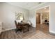 Home office with desk and seating area, open to dining area at 4803 Cabreo Ct, Bradenton, FL 34211
