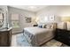 King-size bed, nightstands, and large windows in this serene bedroom at 4803 Cabreo Ct, Bradenton, FL 34211