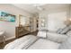 Bright bedroom with two twin beds, dresser, and hardwood floors at 4803 Cabreo Ct, Bradenton, FL 34211