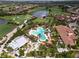 Community pool and clubhouse with surrounding landscape at 4803 Cabreo Ct, Bradenton, FL 34211