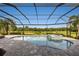 Relaxing pool and spa with covered patio and lush landscaping at 4803 Cabreo Ct, Bradenton, FL 34211