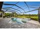 Resort-style pool and spa with covered patio overlooking the golf course at 4803 Cabreo Ct, Bradenton, FL 34211