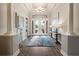 Elegant entryway with hardwood floors, double doors, and a stylish console table at 4803 Cabreo Ct, Bradenton, FL 34211