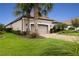 One-story home with gray garage door and manicured lawn at 4803 Cabreo Ct, Bradenton, FL 34211