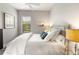 Spacious bedroom with a queen bed and large window at 4803 Cabreo Ct, Bradenton, FL 34211
