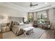 Spacious main bedroom with large windows and sitting area at 4803 Cabreo Ct, Bradenton, FL 34211