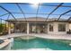 Resort-style pool and patio with outdoor kitchen and seating at 4803 Cabreo Ct, Bradenton, FL 34211