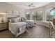 Bedroom with two twin beds, ceiling fan, and large window at 4803 Cabreo Ct, Bradenton, FL 34211