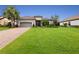 One-story home with gray garage door and manicured lawn at 4803 Cabreo Ct, Bradenton, FL 34211