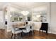 Bright dining area with mirrored walls and modern light fixture at 4803 Cabreo Ct, Bradenton, FL 34211