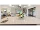 Kitchen island with seating overlooking the living room and outdoor patio at 4803 Cabreo Ct, Bradenton, FL 34211