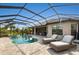 Luxury pool and spa with screened enclosure and lounge chairs at 4803 Cabreo Ct, Bradenton, FL 34211