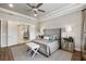 Main bedroom suite with king bed and ensuite bathroom access at 4803 Cabreo Ct, Bradenton, FL 34211