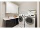 Laundry room with washer, dryer, and cabinets at 4803 Cabreo Ct, Bradenton, FL 34211