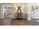 Hardwood floor hallway with built-in storage and view of living room at 4803 Cabreo Ct, Bradenton, FL 34211