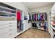 Large walk-in closet with custom shelving and hanging rods at 4803 Cabreo Ct, Bradenton, FL 34211