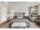 Main bedroom with a comfortable king bed and mirrored nightstands at 4803 Cabreo Ct, Bradenton, FL 34211