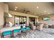 Covered patio with outdoor kitchen and bar seating, near the pool at 4803 Cabreo Ct, Bradenton, FL 34211